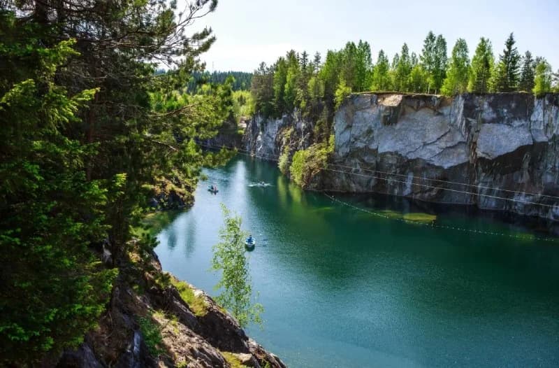 Ruskeala canyon seen from a lakeside path