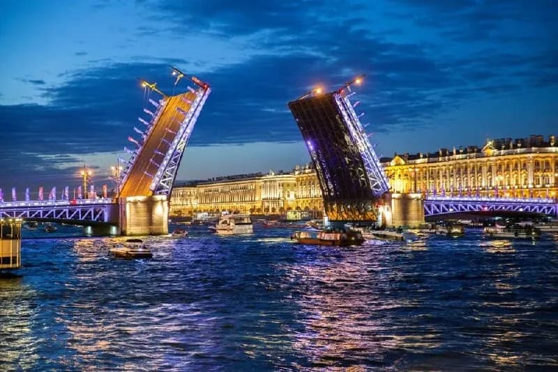 Illuminated Palace Bridge reflected in the Neva